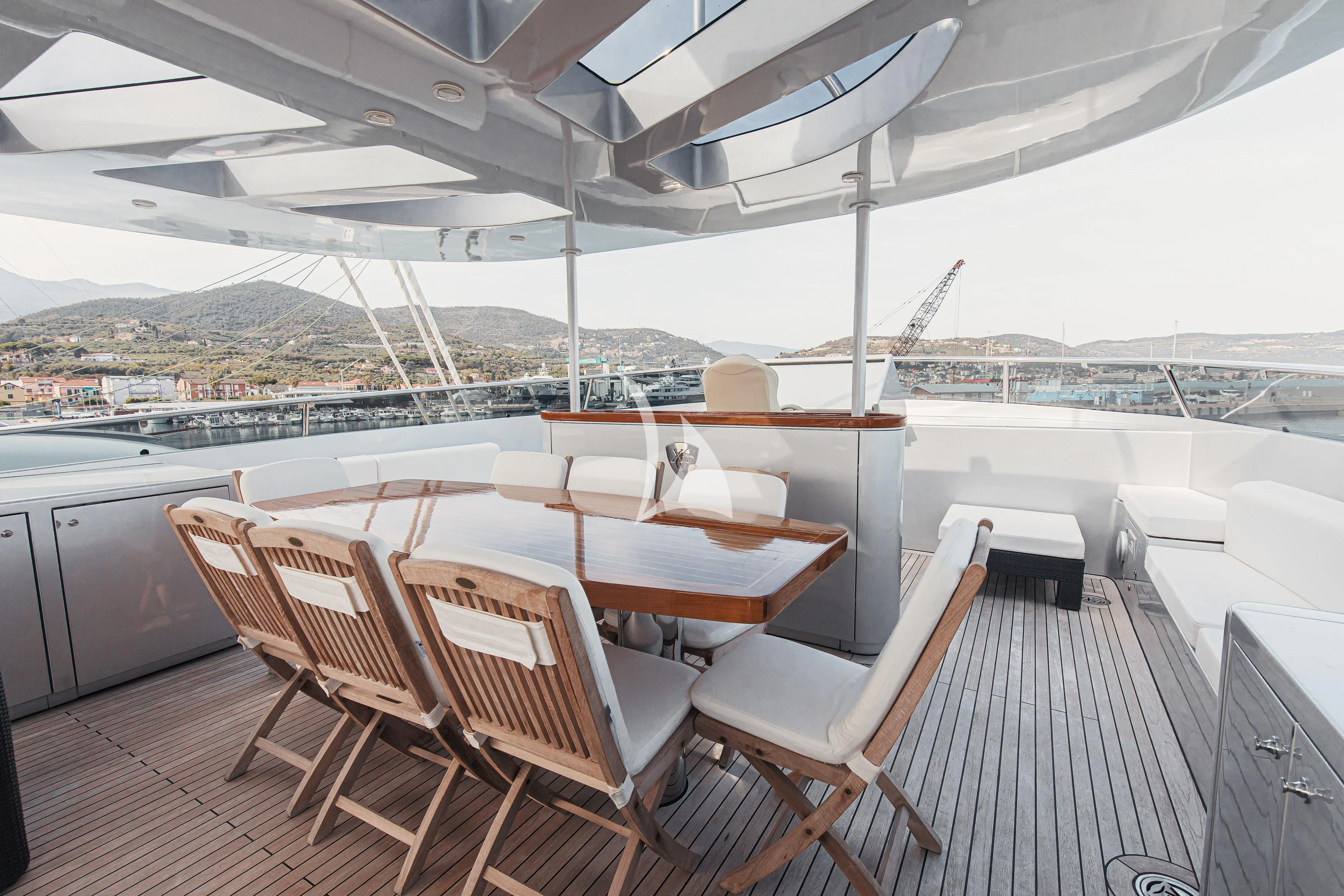 a deck with chairs on it aboard XO OF THE SEAS Yacht for Sale