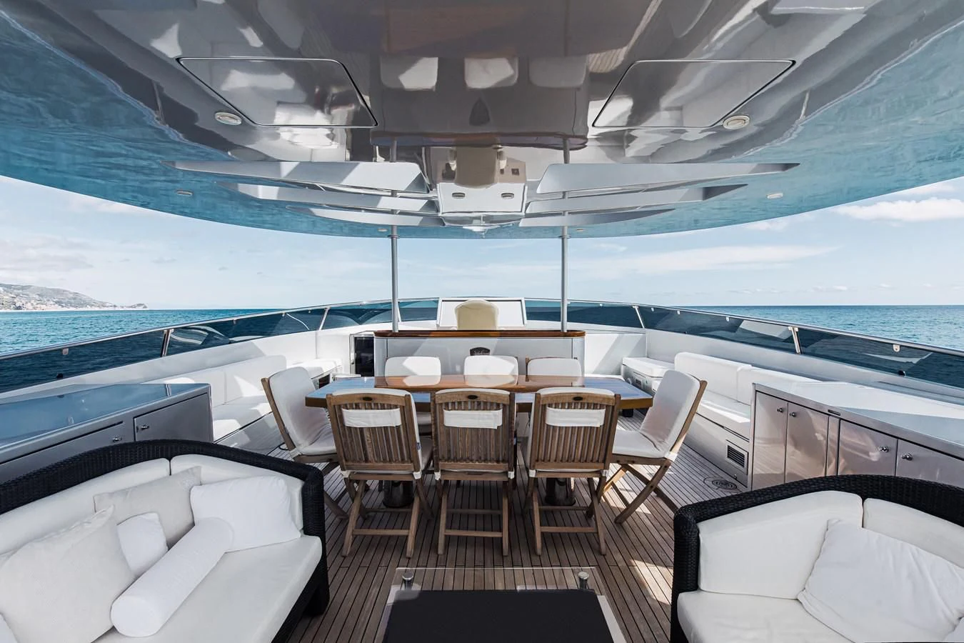 a boat with tables and chairs aboard XO OF THE SEAS Yacht for Sale