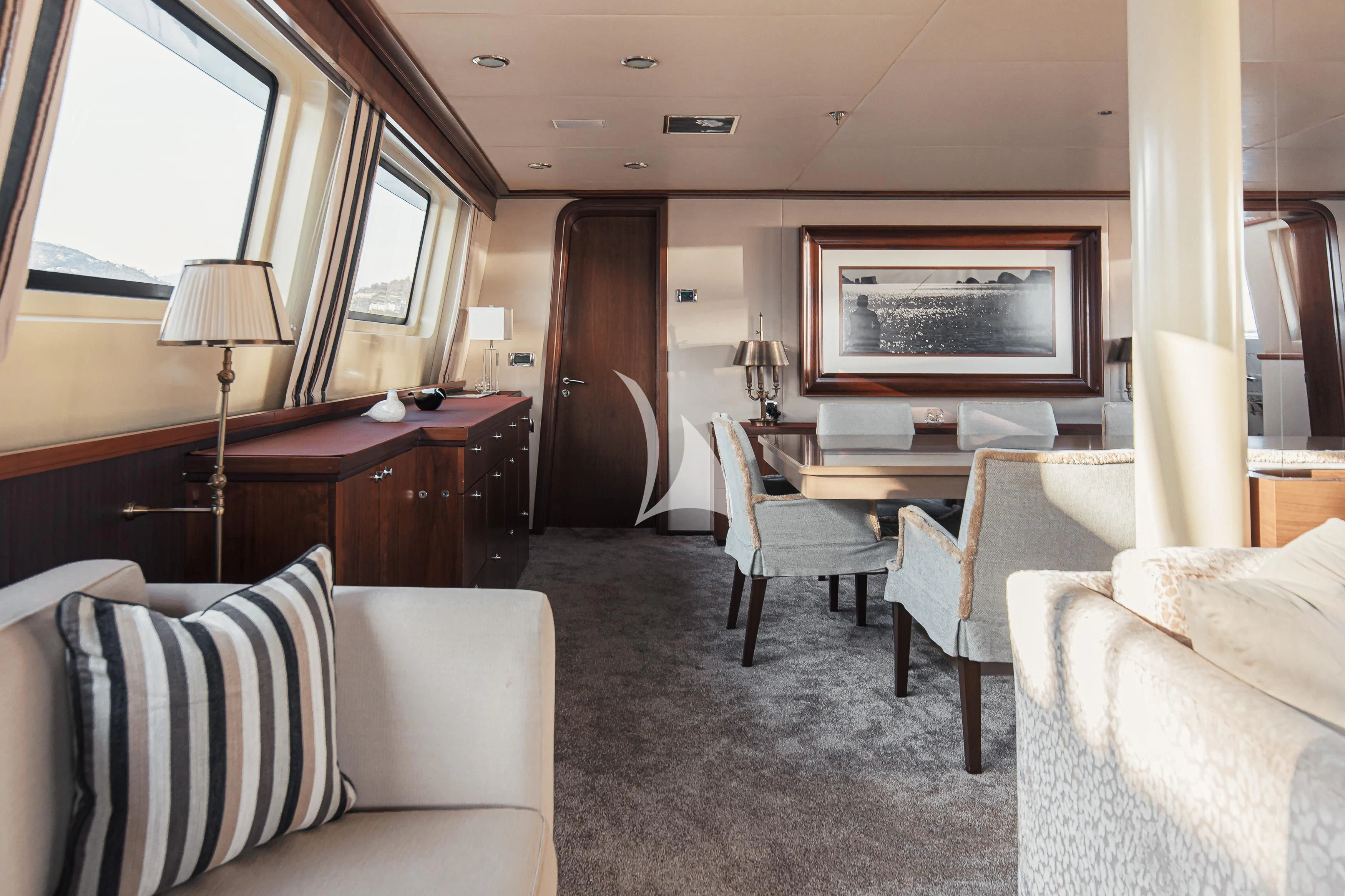 a living room with a couch and a table aboard XO OF THE SEAS Yacht for Sale