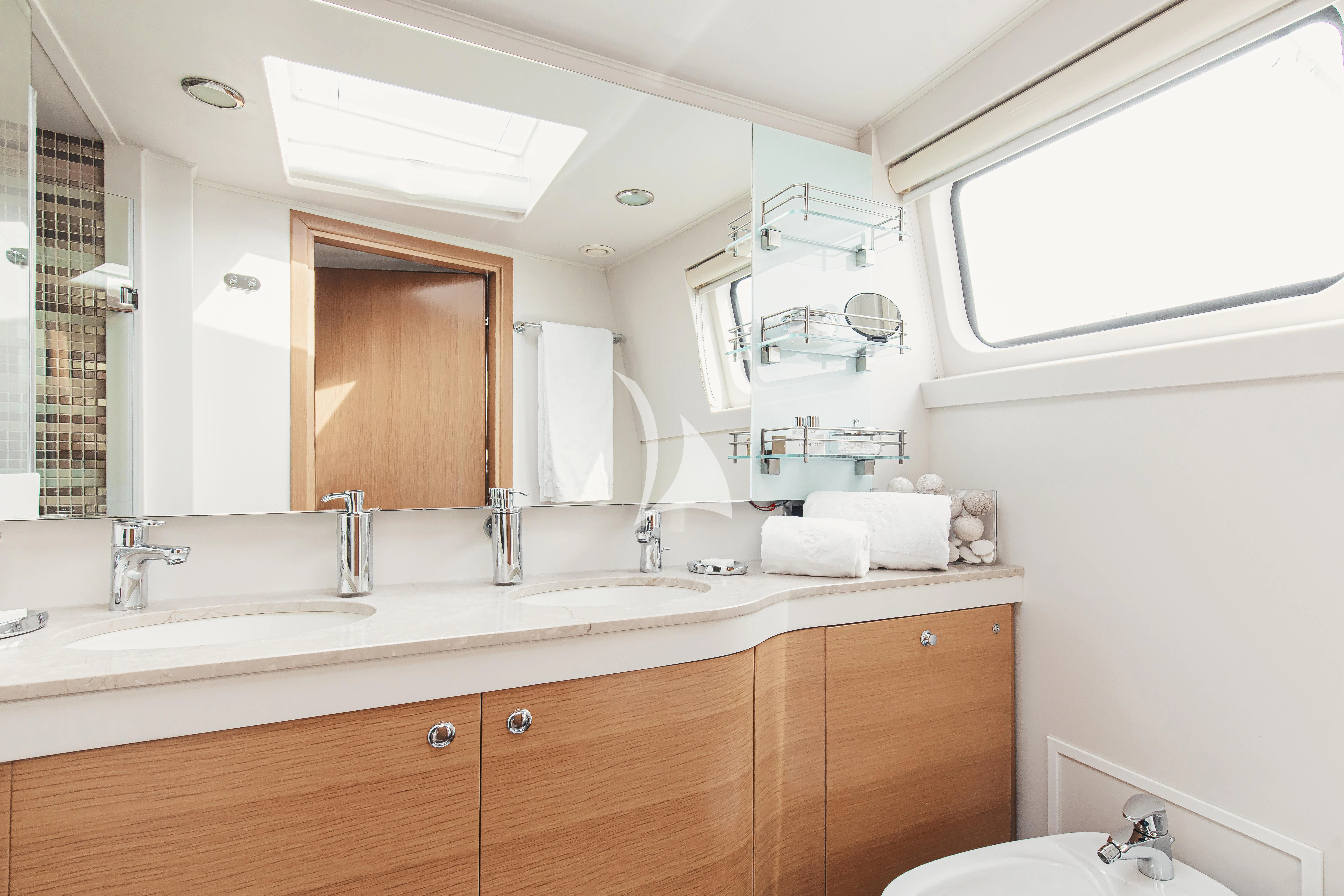 a bathroom with a large mirror aboard XO OF THE SEAS Yacht for Sale