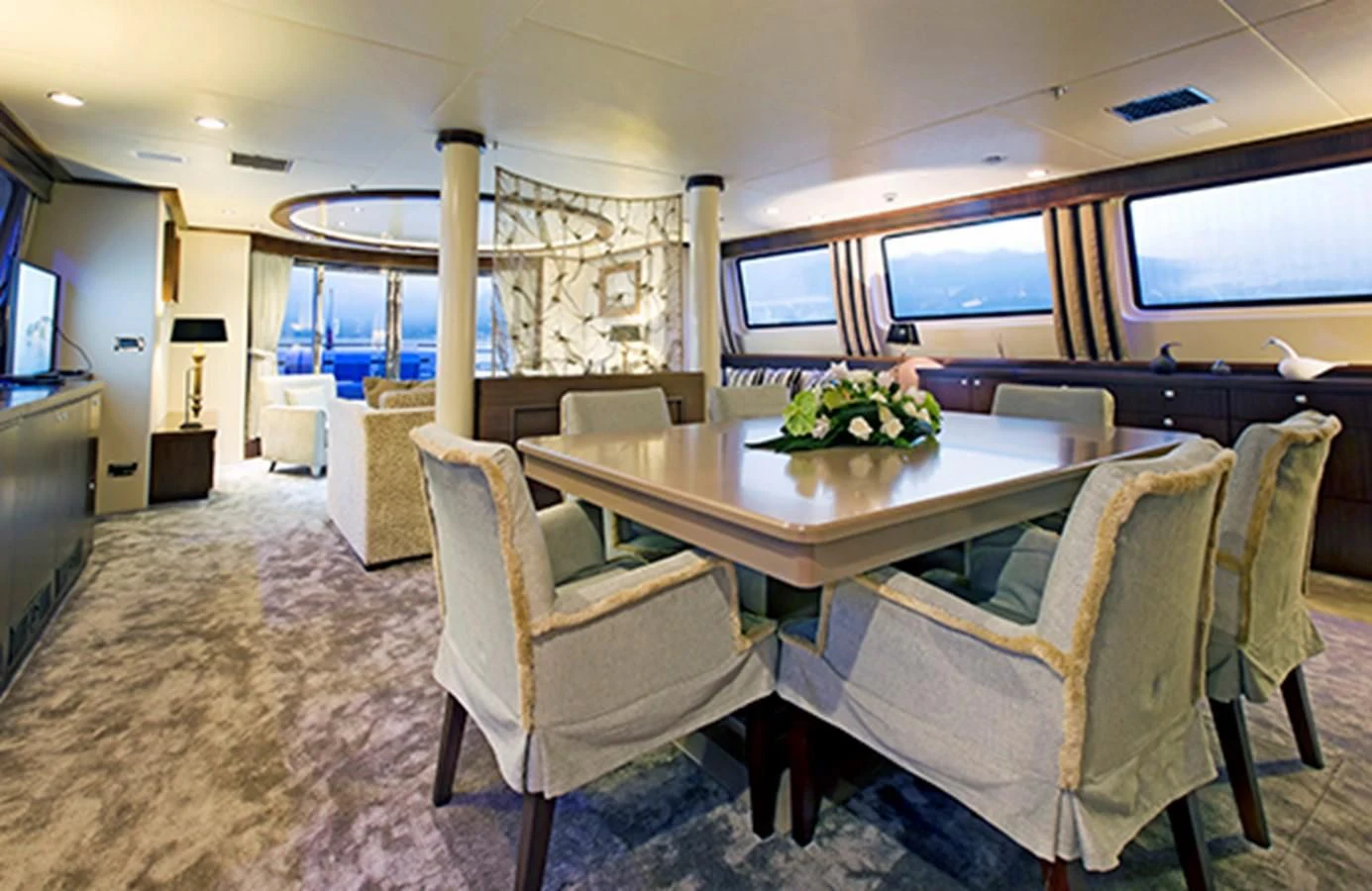 a room with a table and chairs aboard XO OF THE SEAS Yacht for Sale