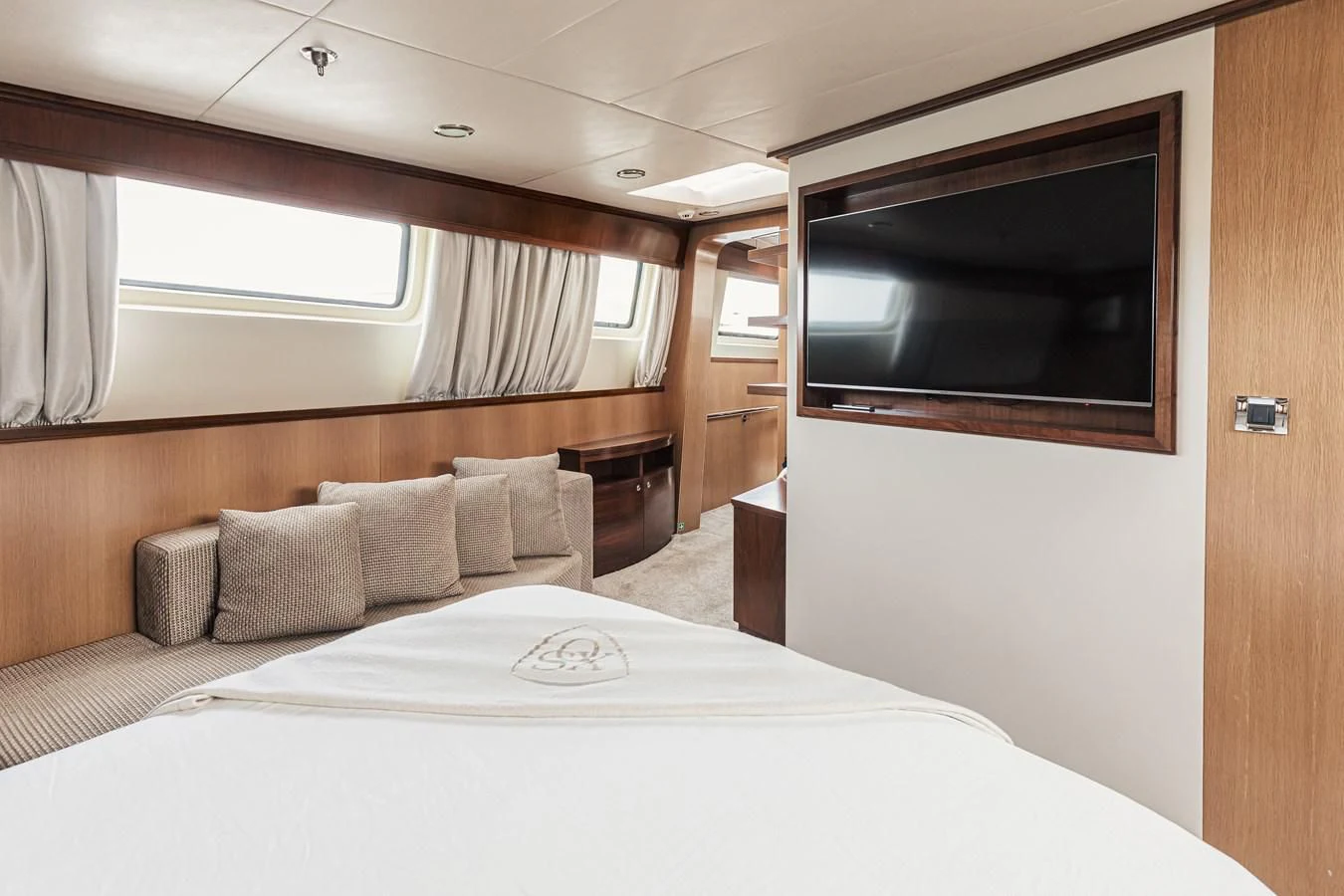 a bed in a room aboard XO OF THE SEAS Yacht for Sale