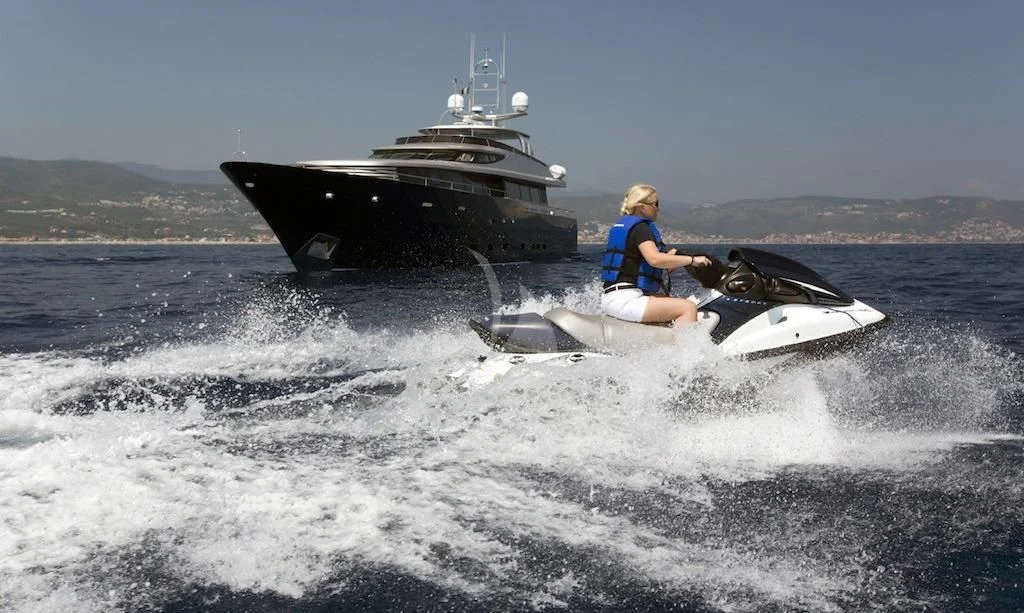 a man on a jet ski aboard XO OF THE SEAS Yacht for Sale