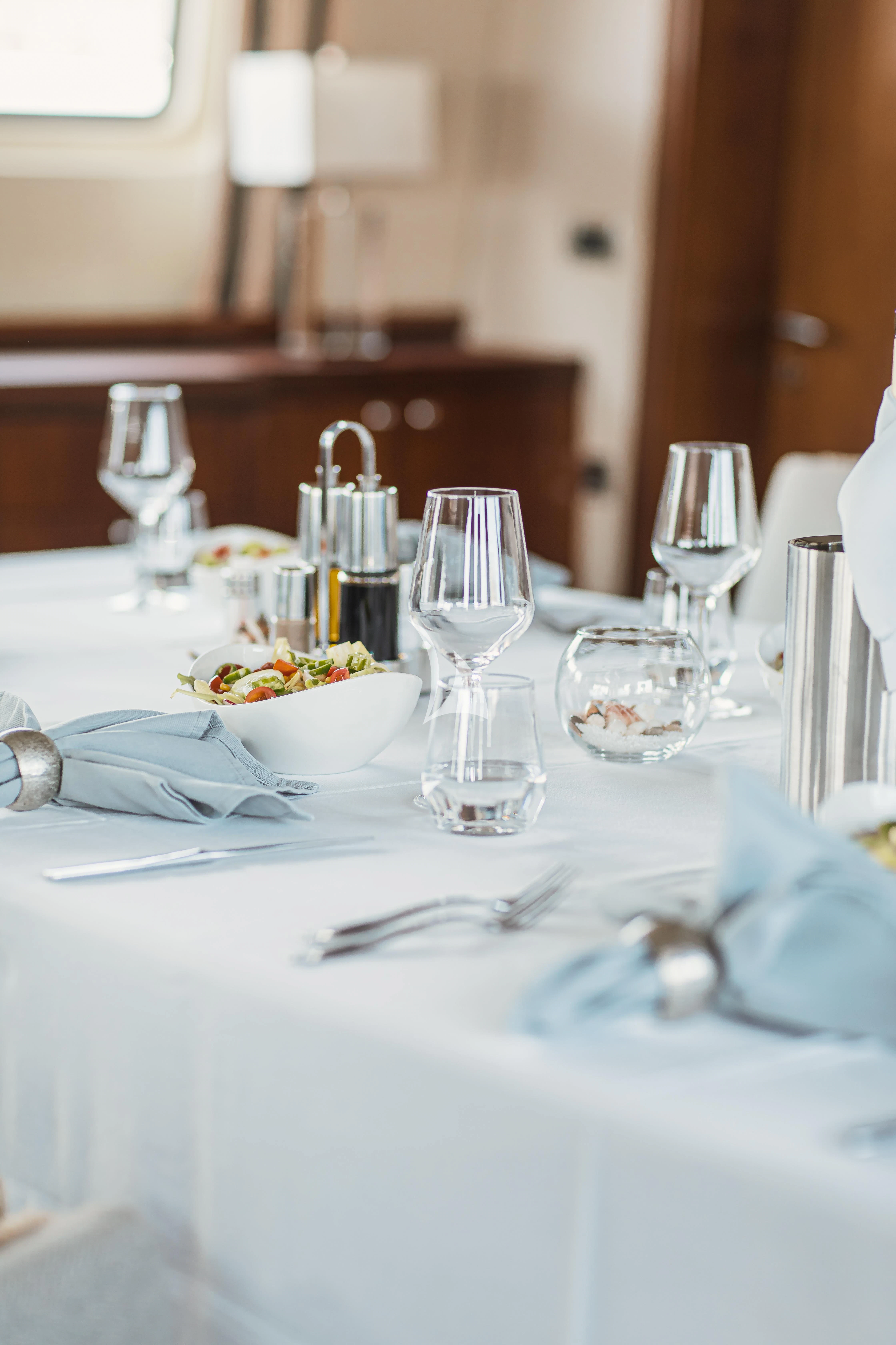 a table with place settings aboard XO OF THE SEAS Yacht for Sale