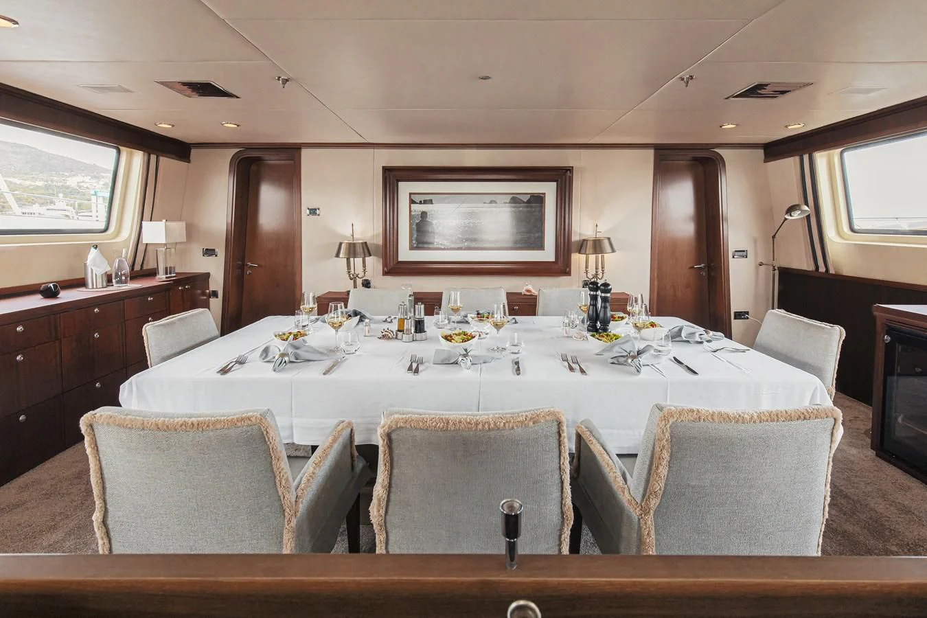 a large dining table with a large white tablecloth aboard XO OF THE SEAS Yacht for Sale