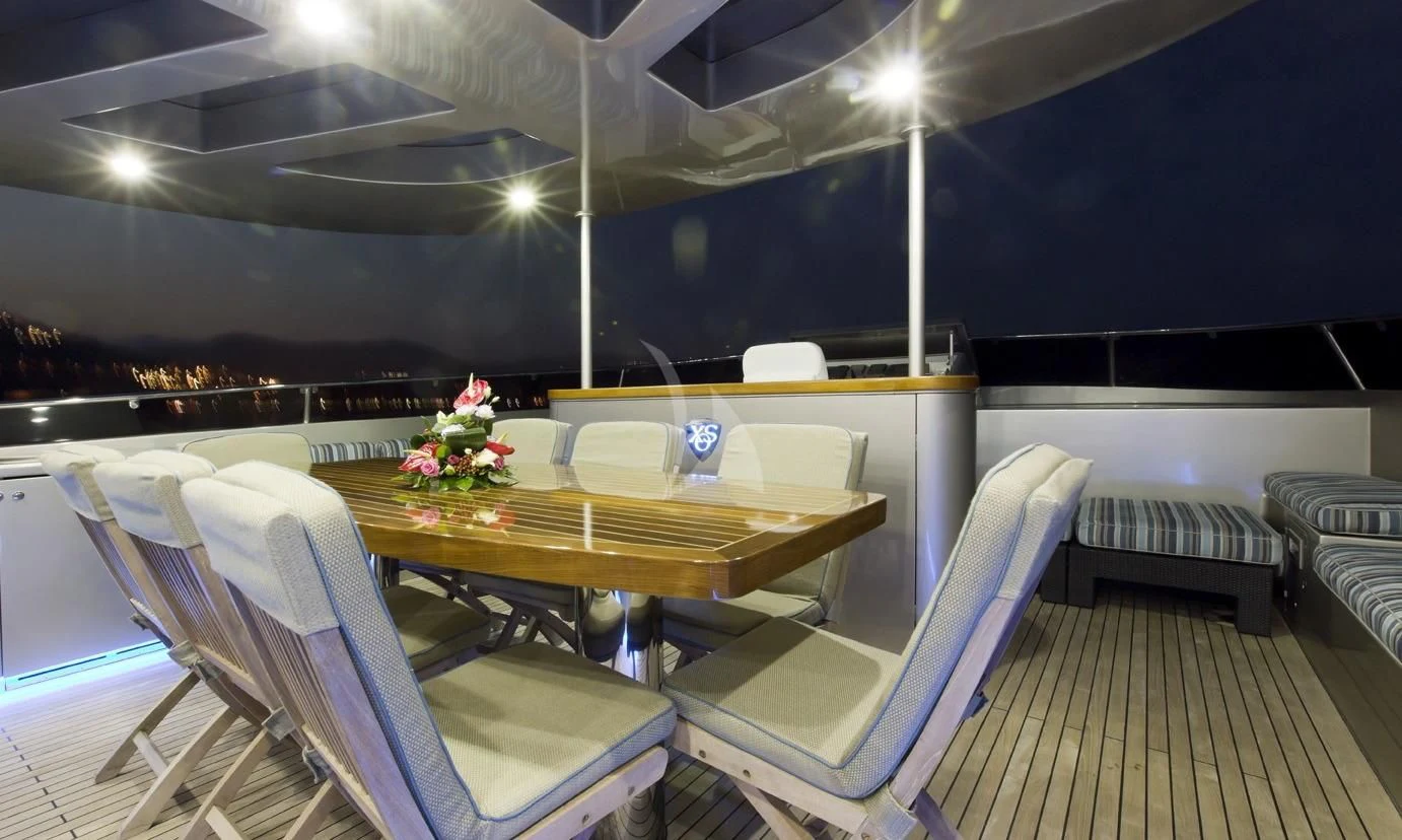 a room with a table and chairs aboard XO OF THE SEAS Yacht for Sale