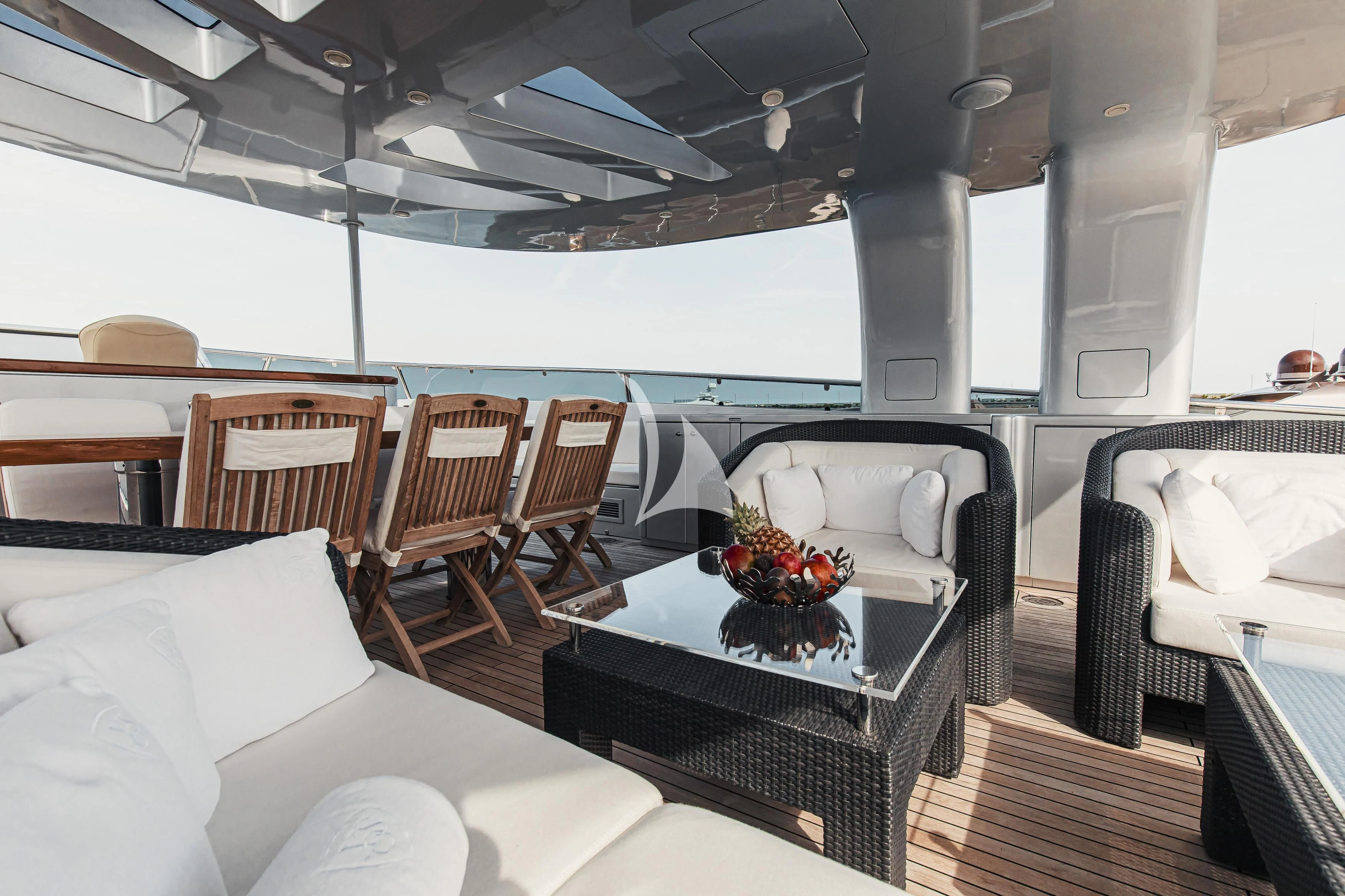 a room with a table and chairs aboard XO OF THE SEAS Yacht for Sale