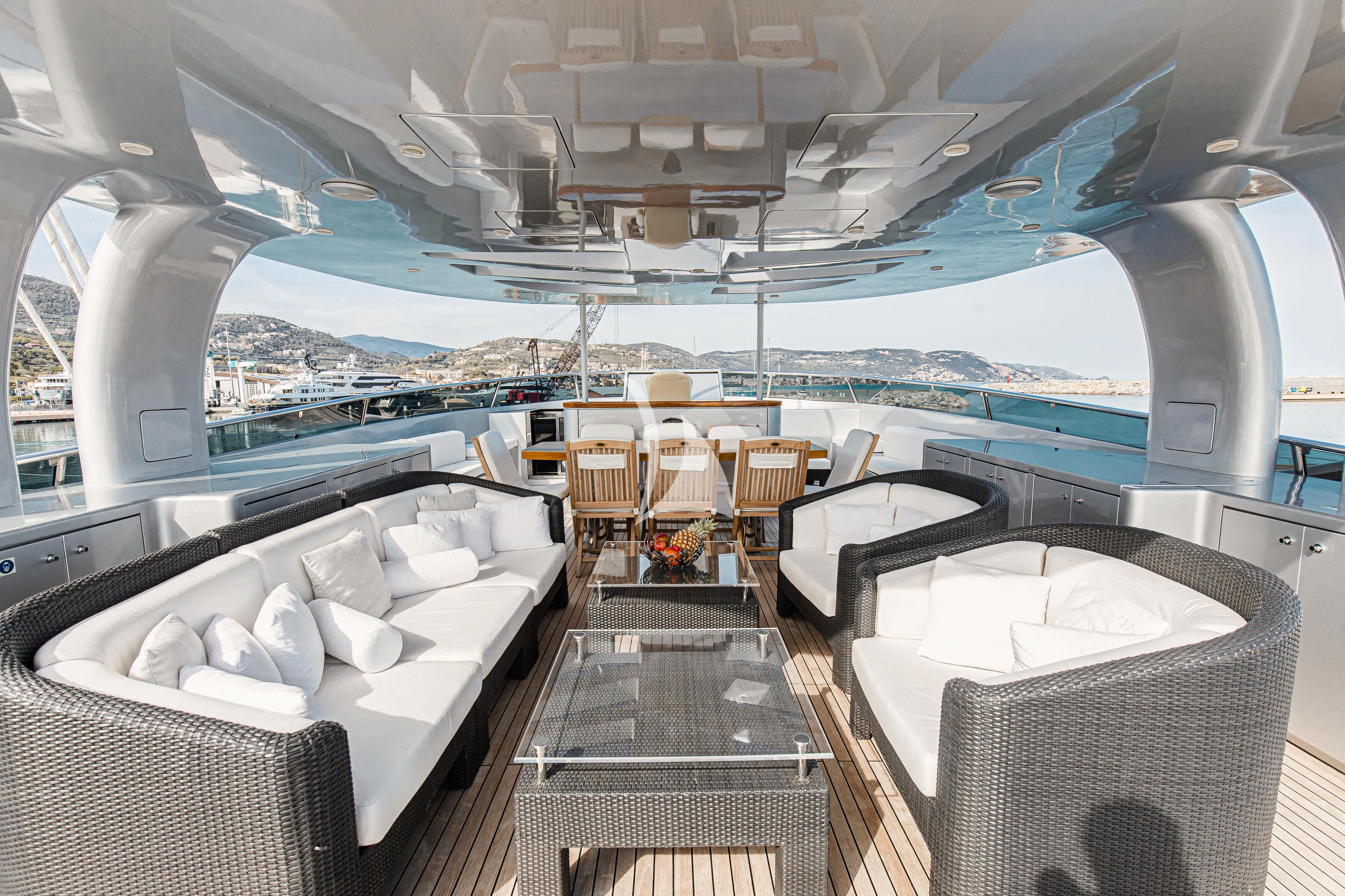 a room with a table and chairs aboard XO OF THE SEAS Yacht for Sale