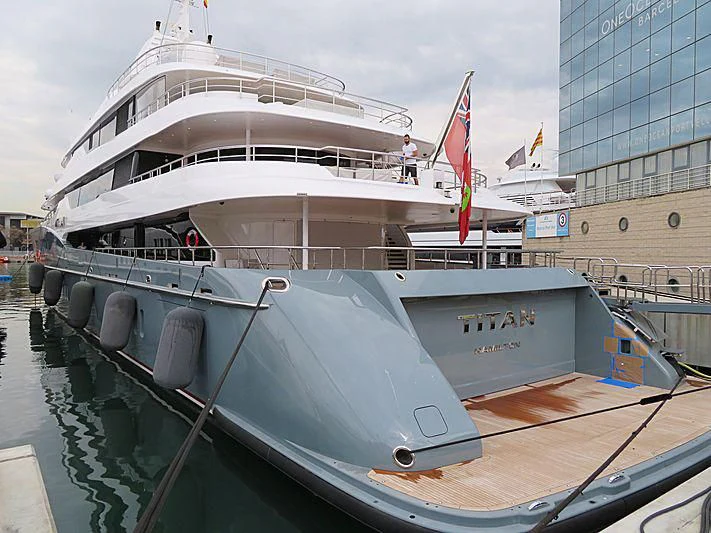 a large white boat docked aboard TITAN Yacht for Sale