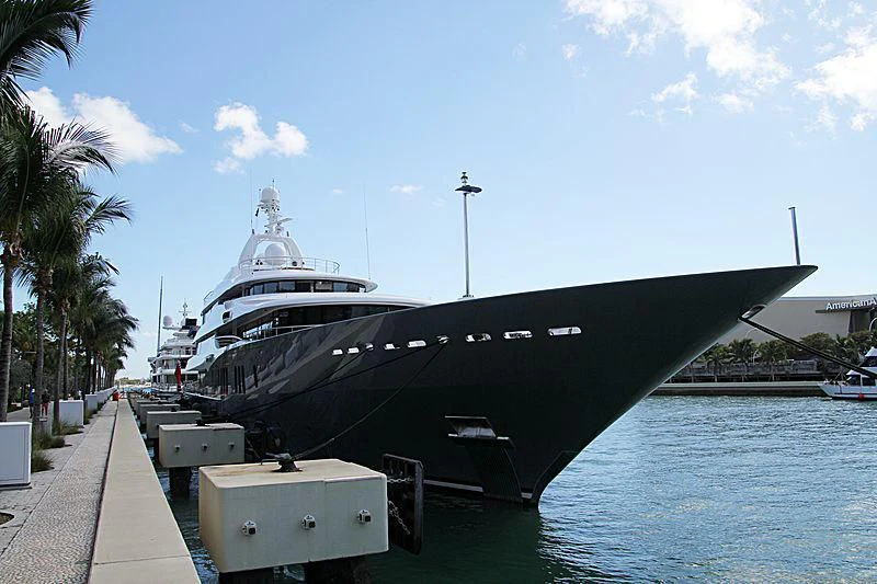 a large black ship docked aboard TITAN Yacht for Sale