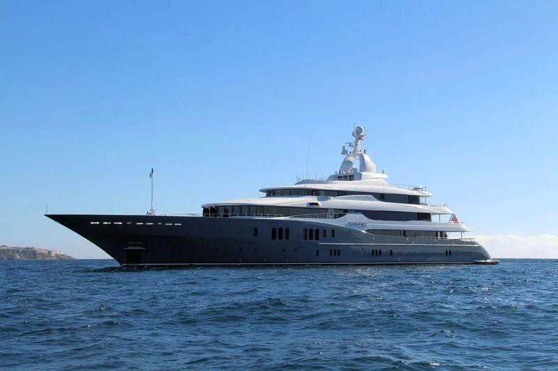 a large ship in the water aboard TITAN Yacht for Sale