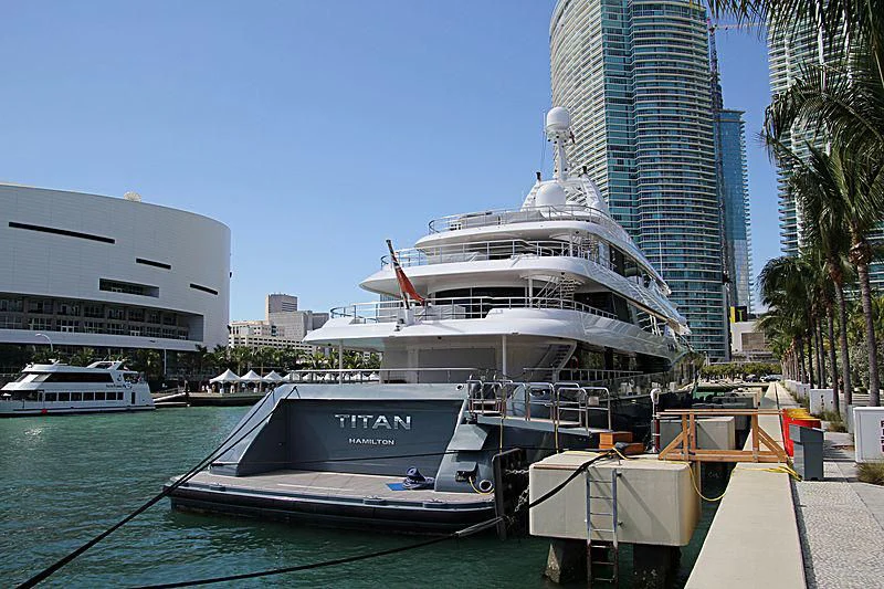 a large white ship docked aboard TITAN Yacht for Sale