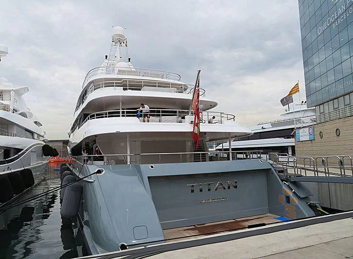 a large white boat docked aboard TITAN Yacht for Sale