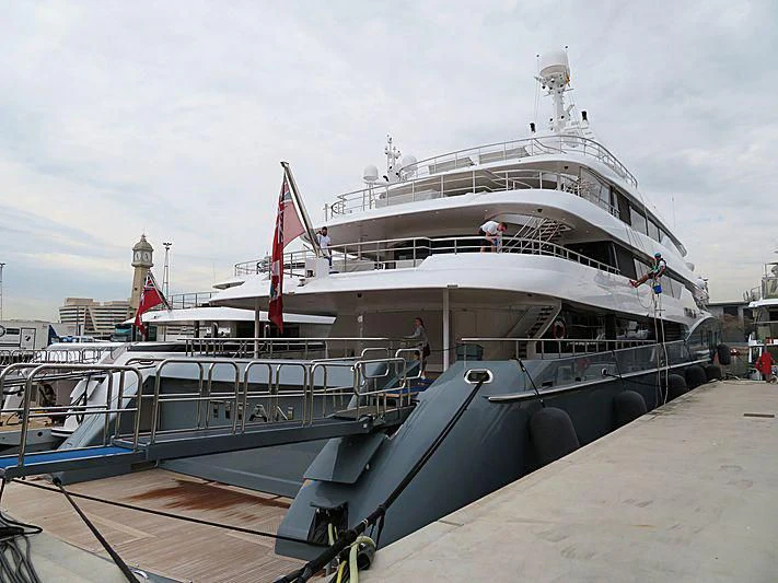 a large white ship docked aboard TITAN Yacht for Sale