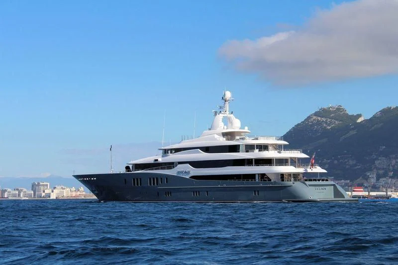 a white yacht in the water aboard TITAN Yacht for Sale