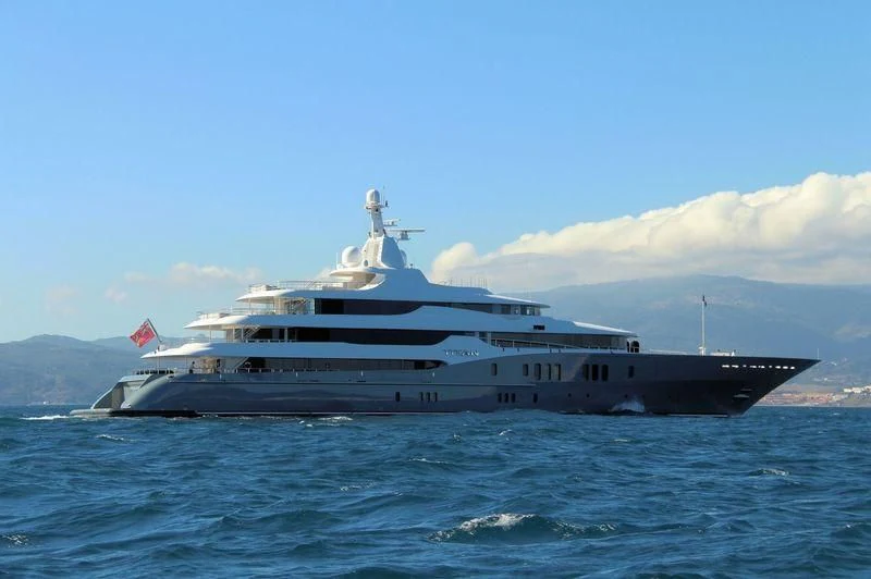 a large ship in the water aboard TITAN Yacht for Sale