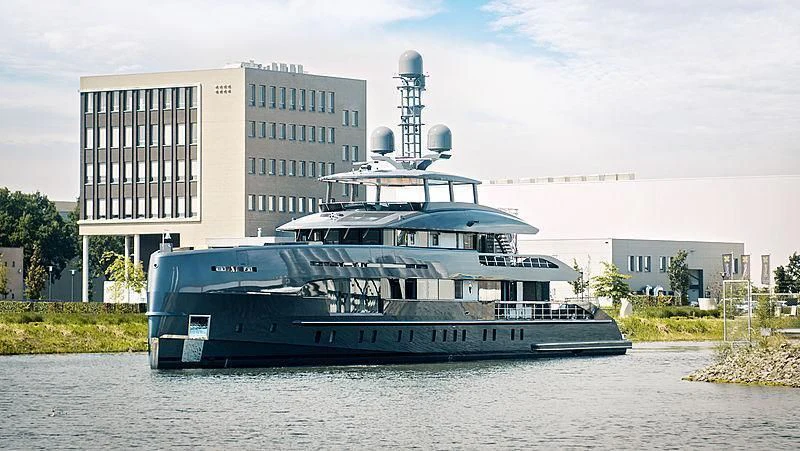a large ship in the water aboard TOUTE SWEET Yacht for Sale