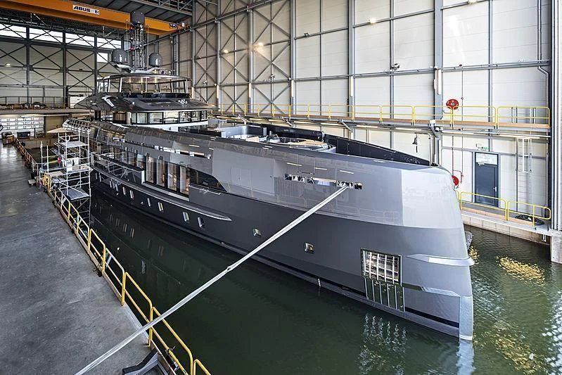 a large boat docked in a large building aboard TOUTE SWEET Yacht for Sale