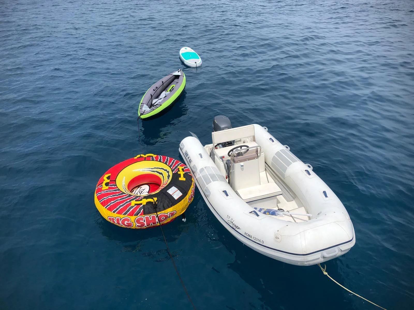 a boat with a paddle and a paddle on the water aboard SHANGRA Yacht for Sale