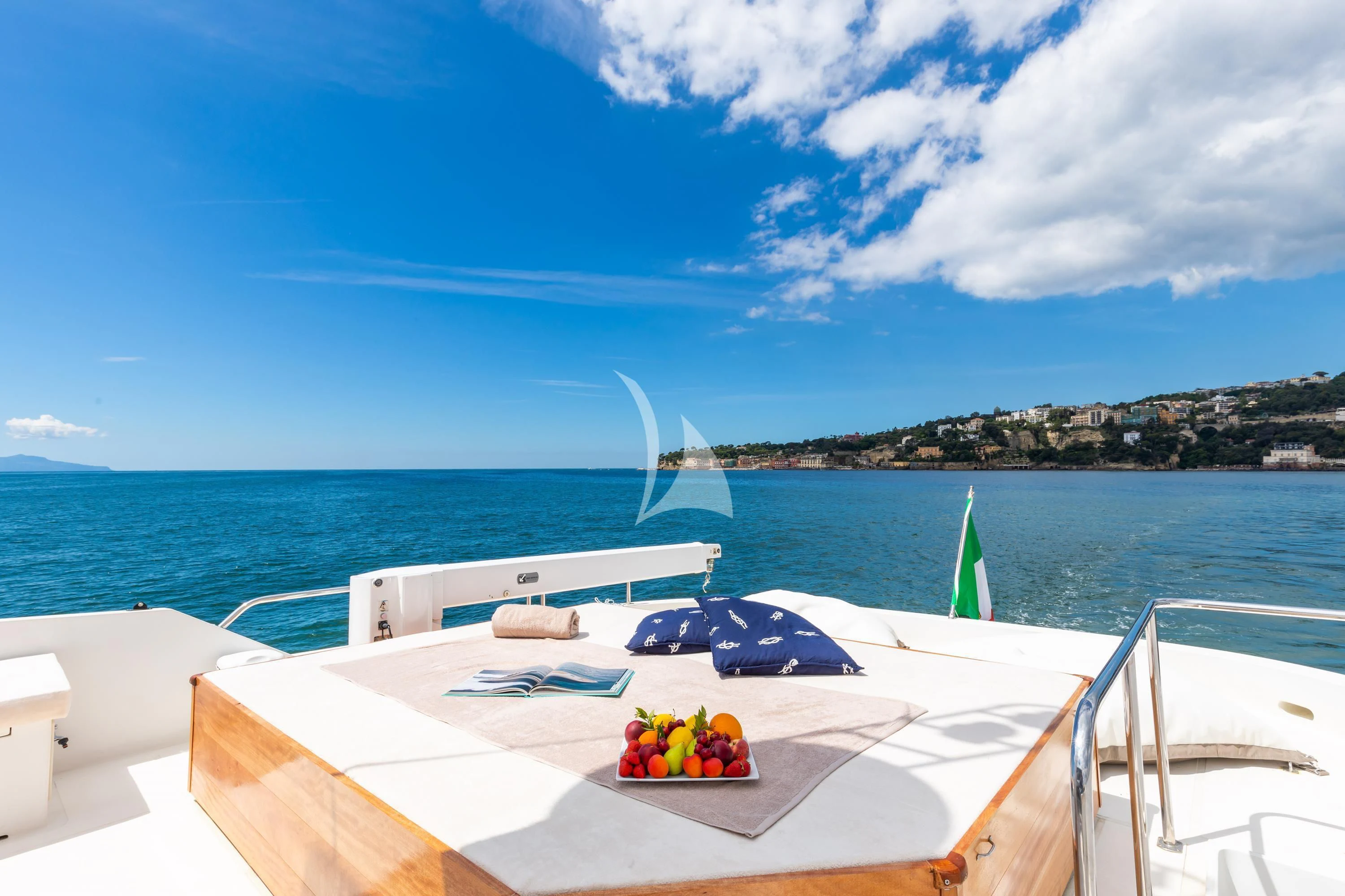 a boat with a fruit on the water aboard SHANGRA Yacht for Sale