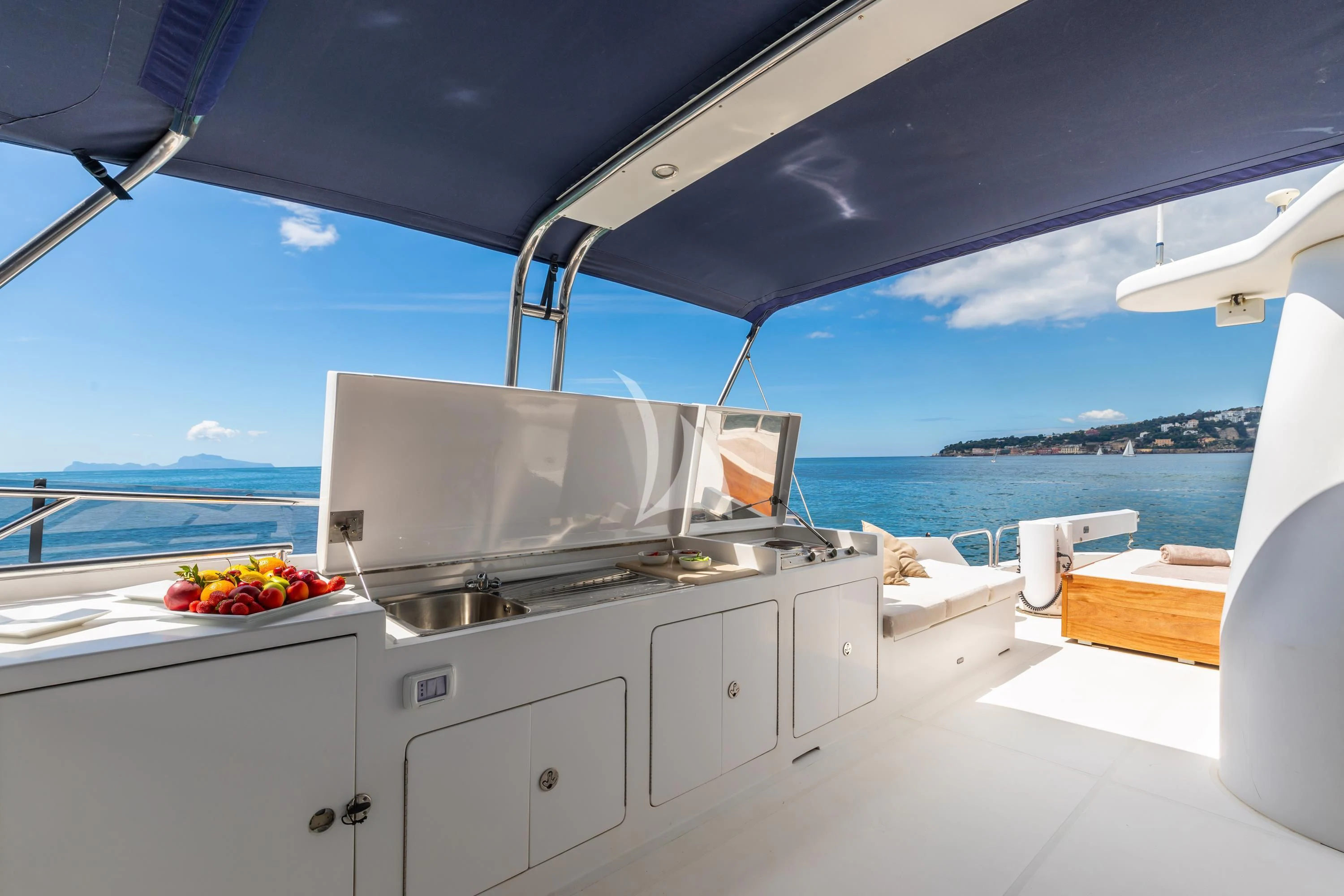 a kitchen with a view of the ocean and the ocean aboard SHANGRA Yacht for Sale