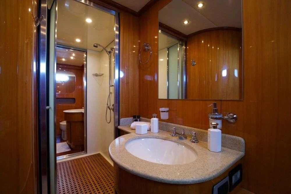 a bathroom with a sink and a mirror aboard SHANGRA Yacht for Sale