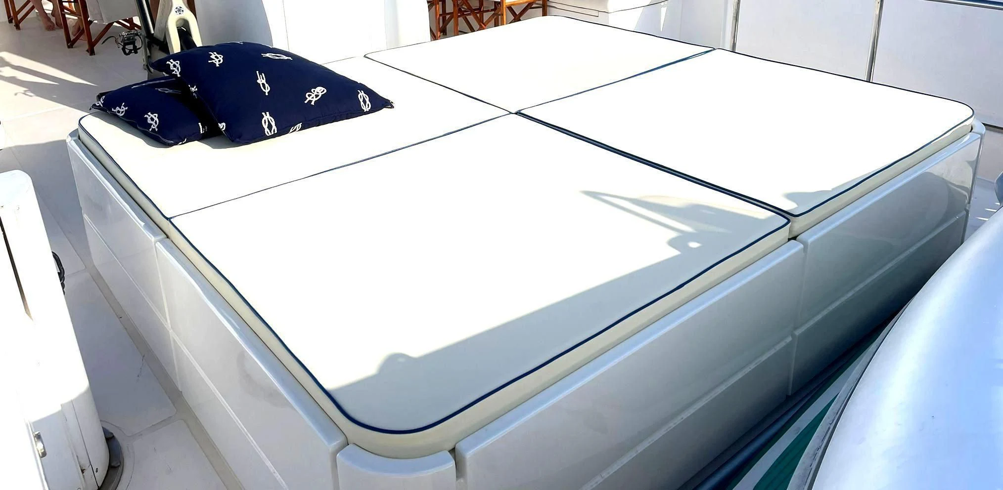 a white rectangular object with a blue bow on it aboard SHANGRA Yacht for Sale