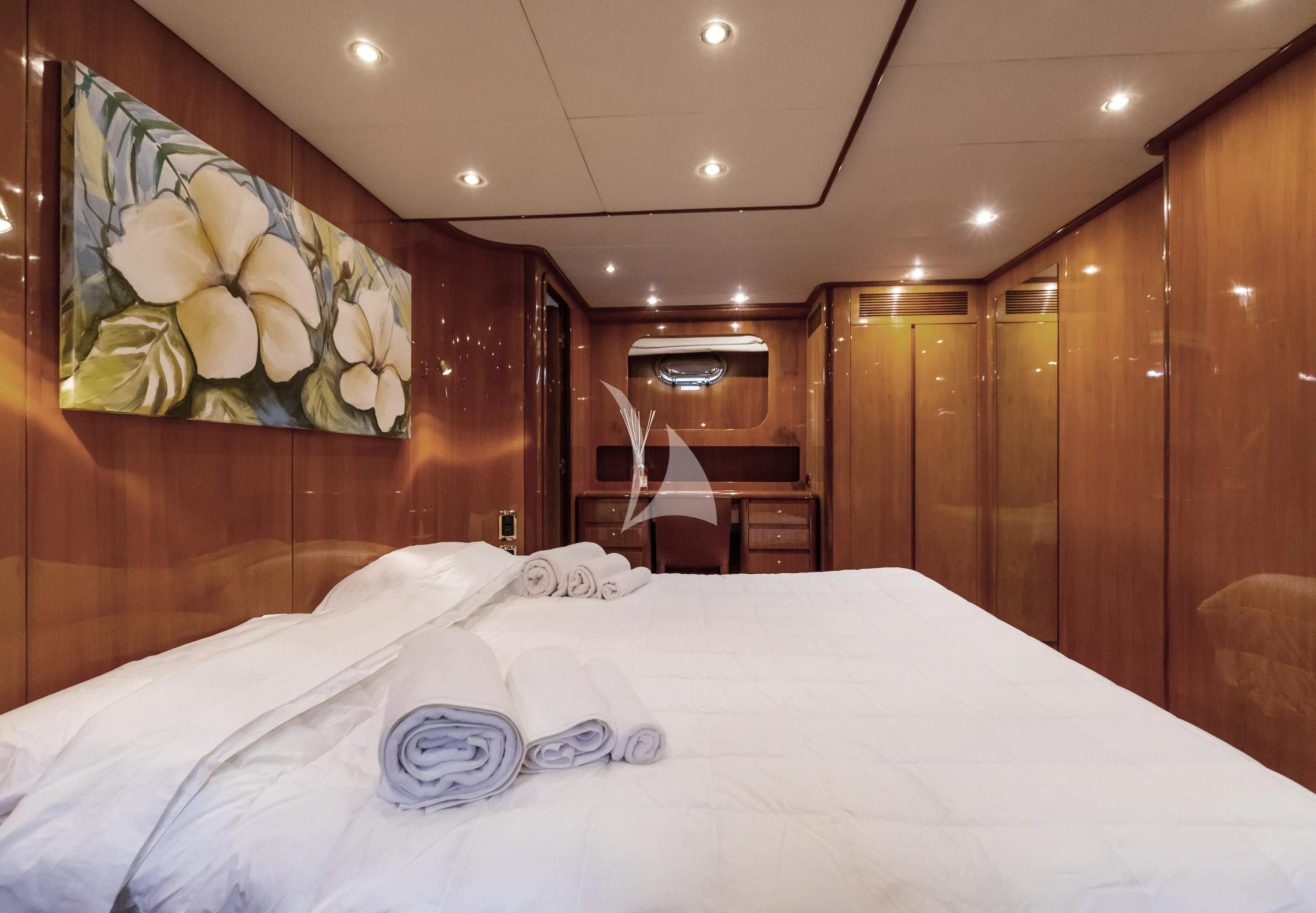 a bed with white sheets aboard SHANGRA Yacht for Sale