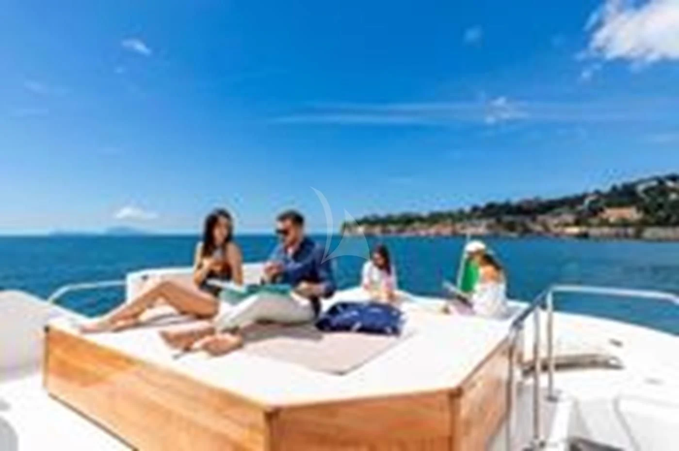 a group of people sitting on a boat aboard SHANGRA Yacht for Sale