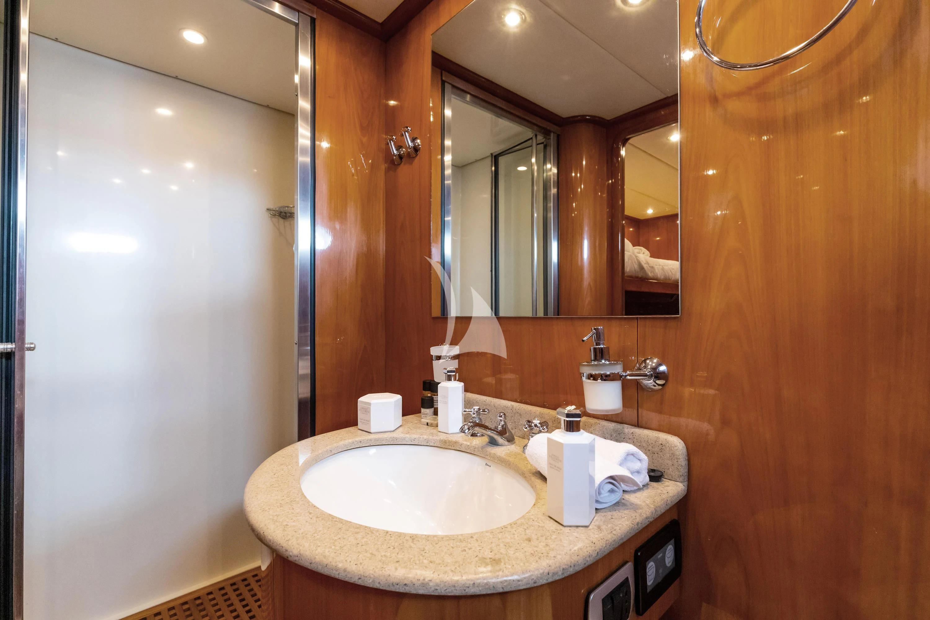 a bathroom with a sink and mirror aboard SHANGRA Yacht for Sale