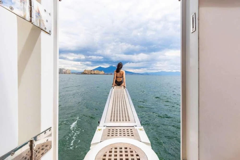 a dog sitting on a boat aboard SHANGRA Yacht for Sale