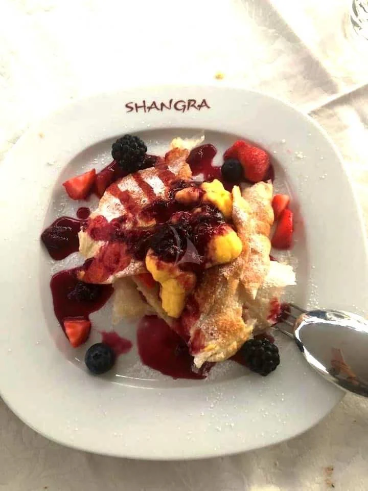 a plate of food aboard SHANGRA Yacht for Sale