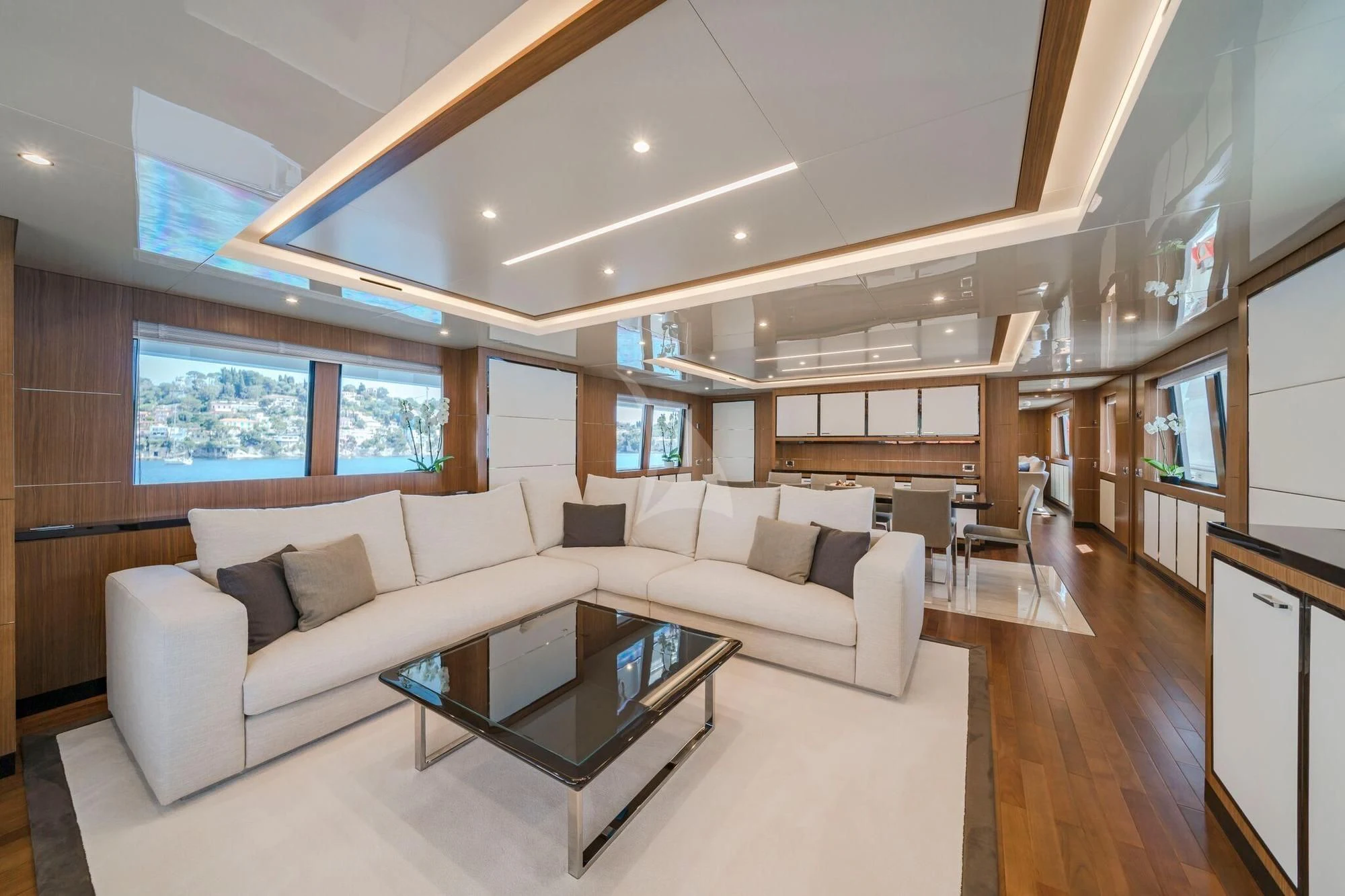 a living room with a couch and a coffee table aboard FIORENTE Yacht for Sale