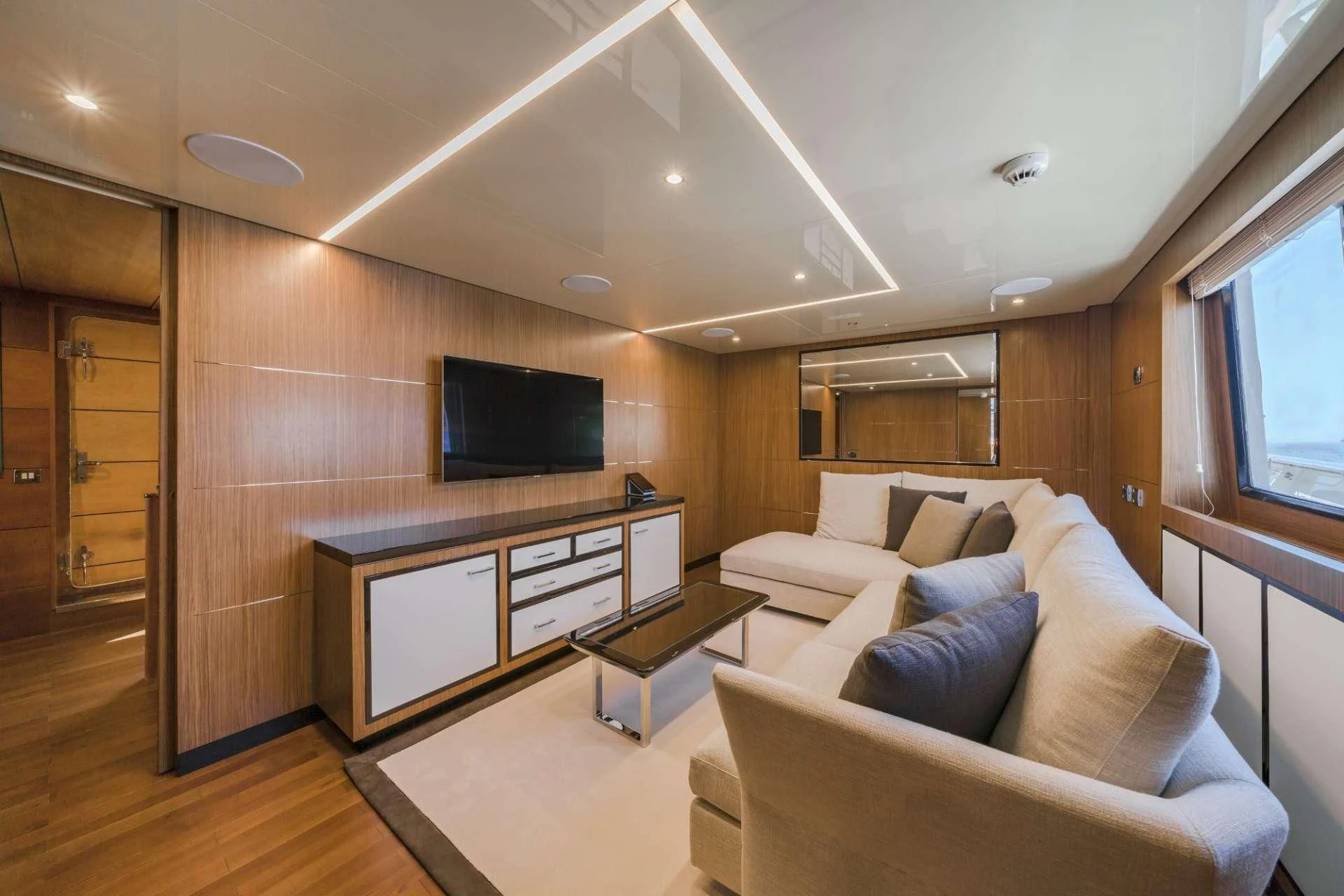 a living room with a couch and a tv aboard FIORENTE Yacht for Sale