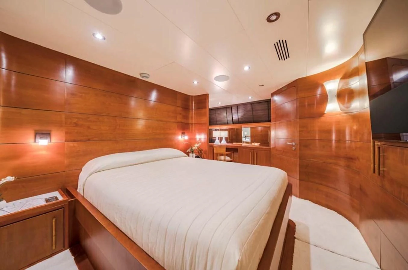 a room with a bed and a wood wall aboard FIORENTE Yacht for Sale