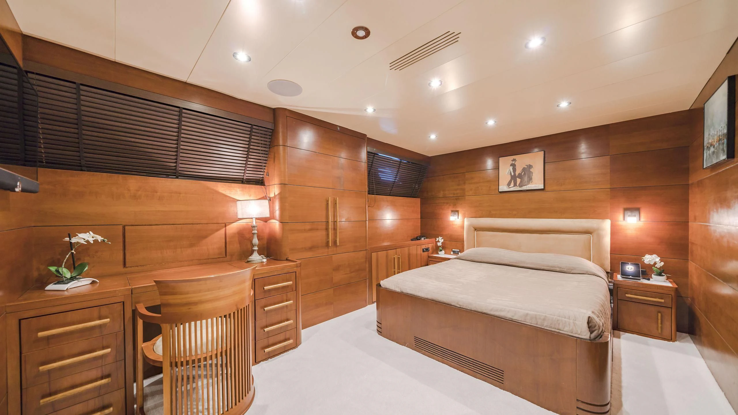a room with a bed and a chair aboard FIORENTE Yacht for Sale