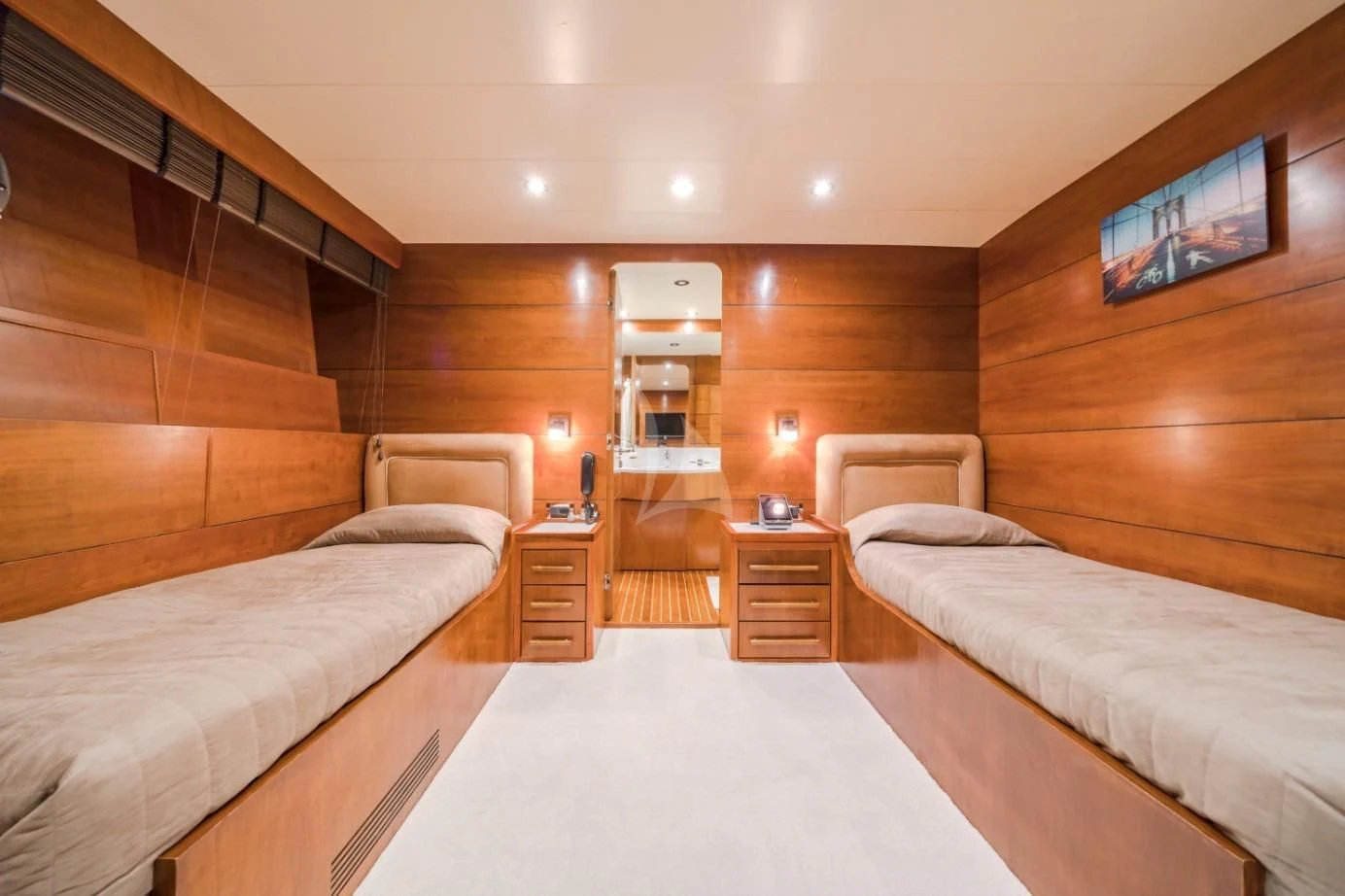 a room with a bed and a tv on the wall aboard FIORENTE Yacht for Sale