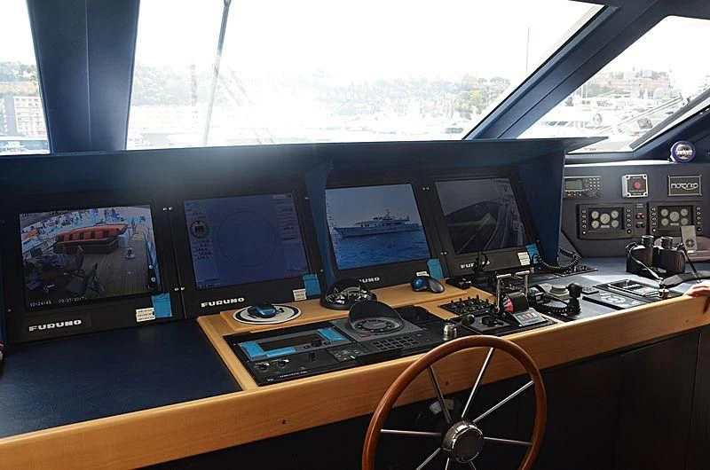 a desk with many monitors and keyboards aboard FIORENTE Yacht for Sale