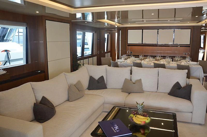 a living room with a large sofa aboard FIORENTE Yacht for Sale