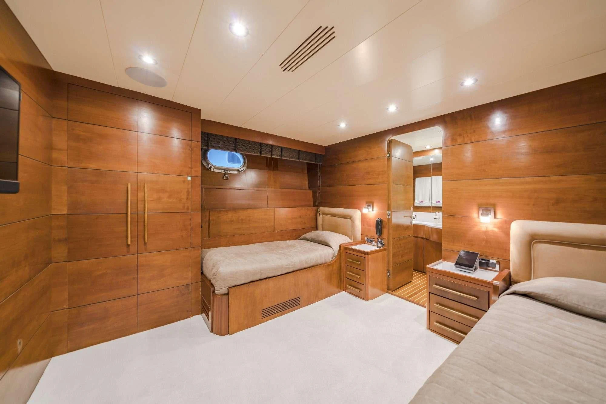 a room with a bed and a desk aboard FIORENTE Yacht for Sale
