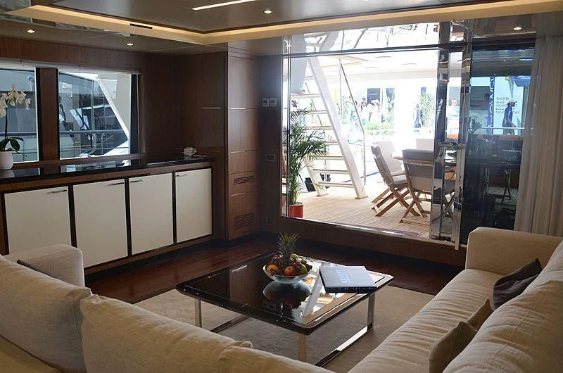 a living room with a glass door aboard FIORENTE Yacht for Sale