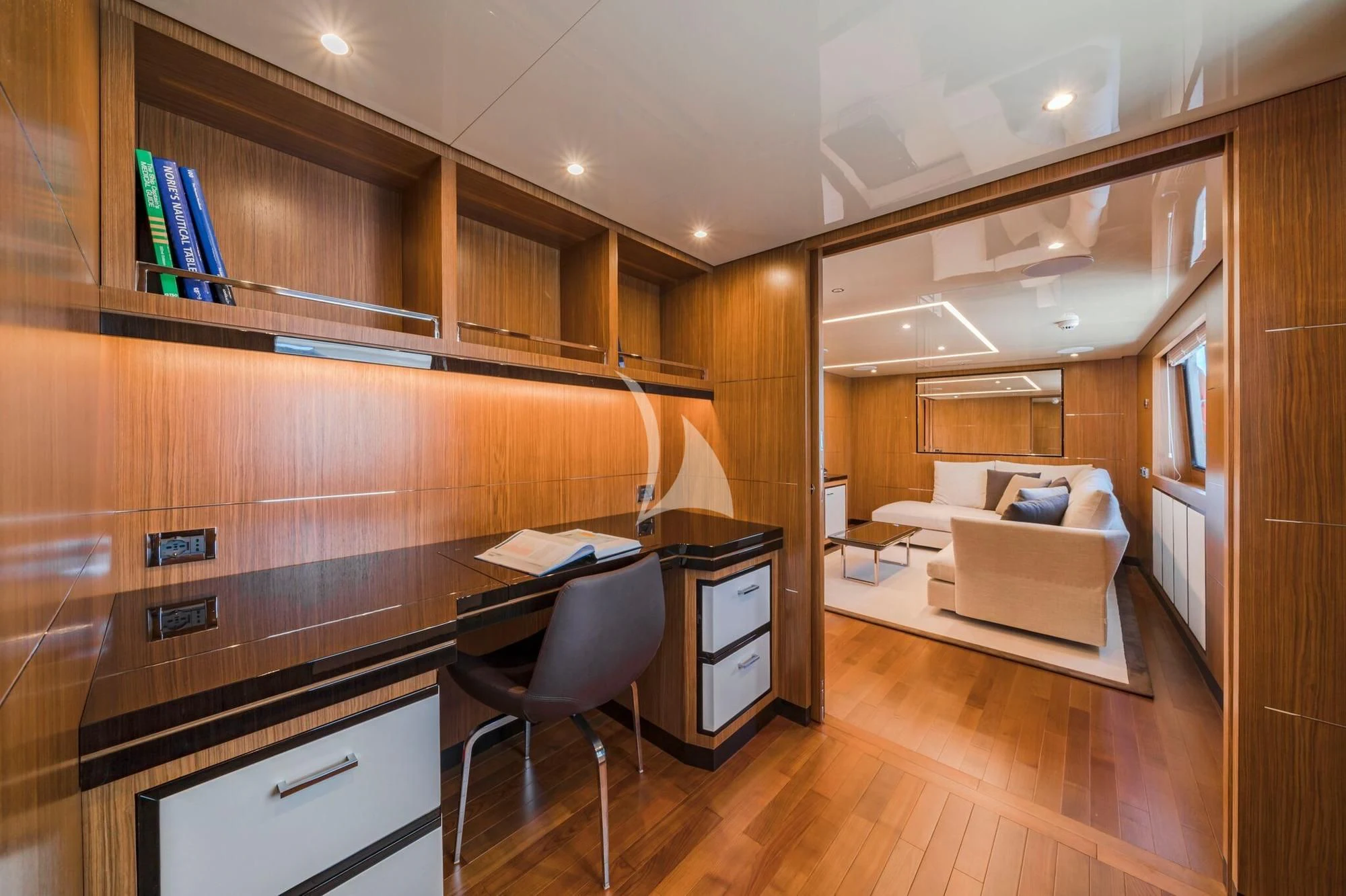 a room with a bed and desk aboard FIORENTE Yacht for Sale