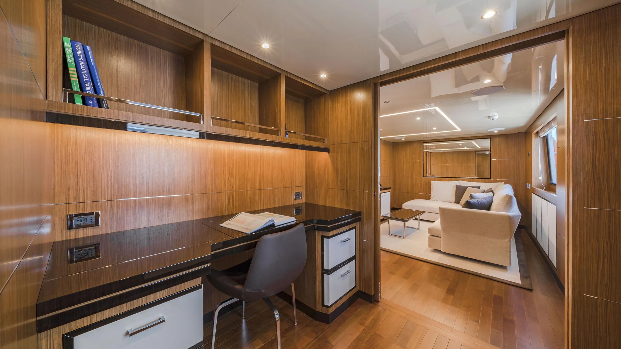a room with a bed and desk aboard FIORENTE Yacht for Sale