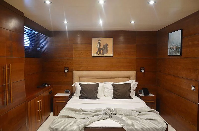 a bed with white sheets and pillows aboard FIORENTE Yacht for Sale