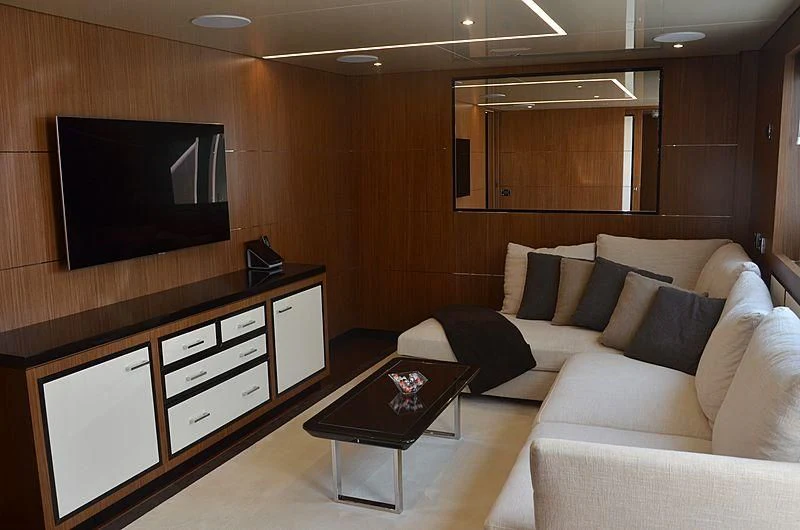 a living room with a couch and a tv aboard FIORENTE Yacht for Sale