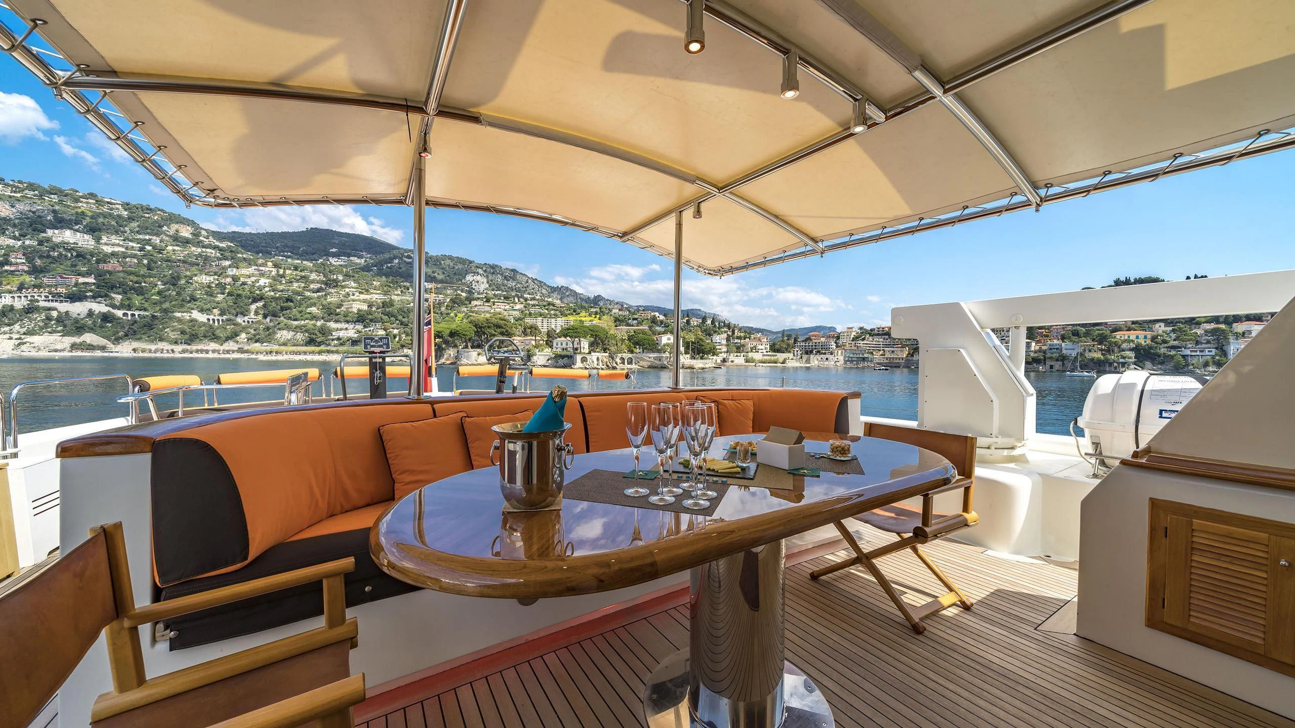 a table with chairs on it aboard FIORENTE Yacht for Sale