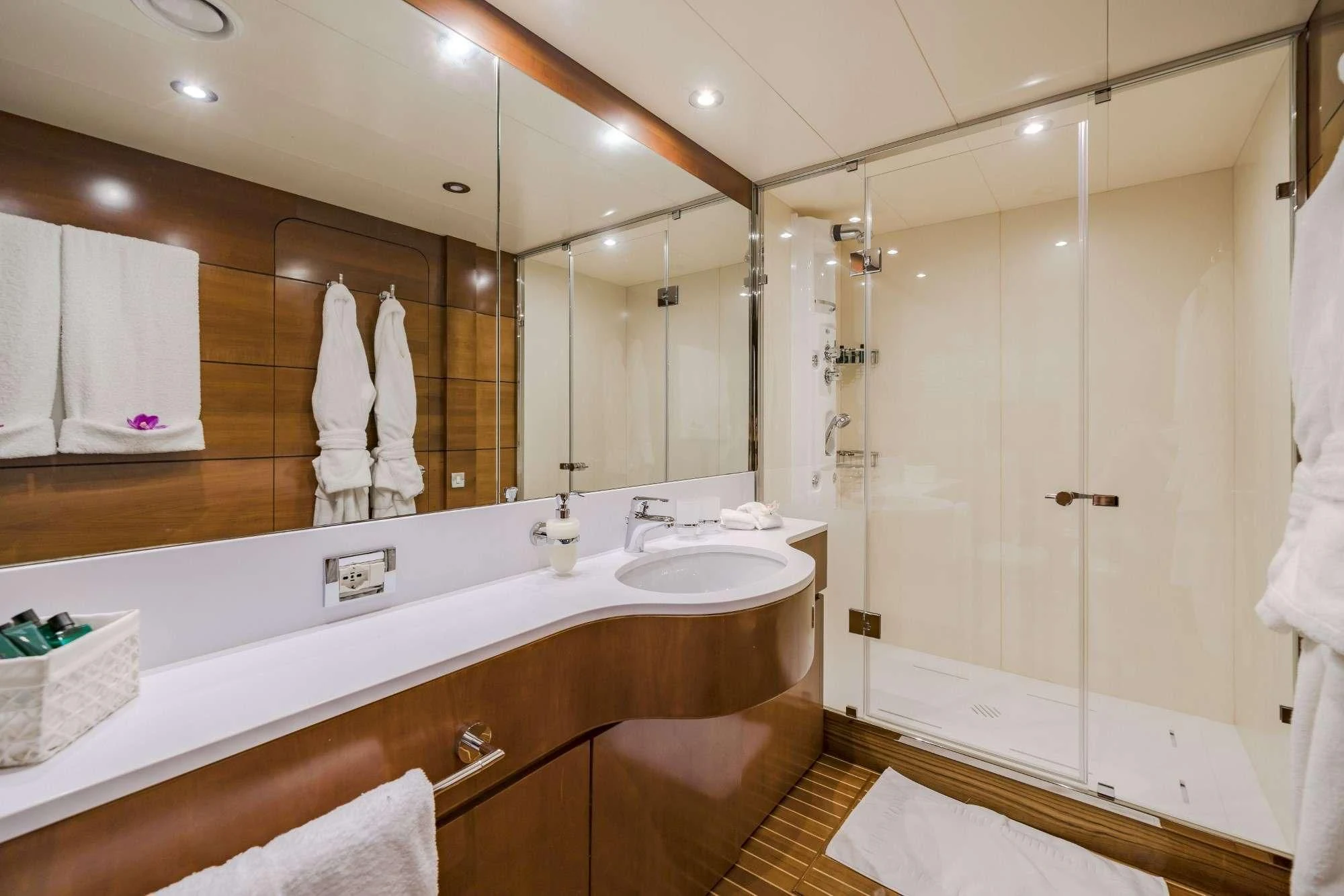 a bathroom with a large mirror aboard FIORENTE Yacht for Sale