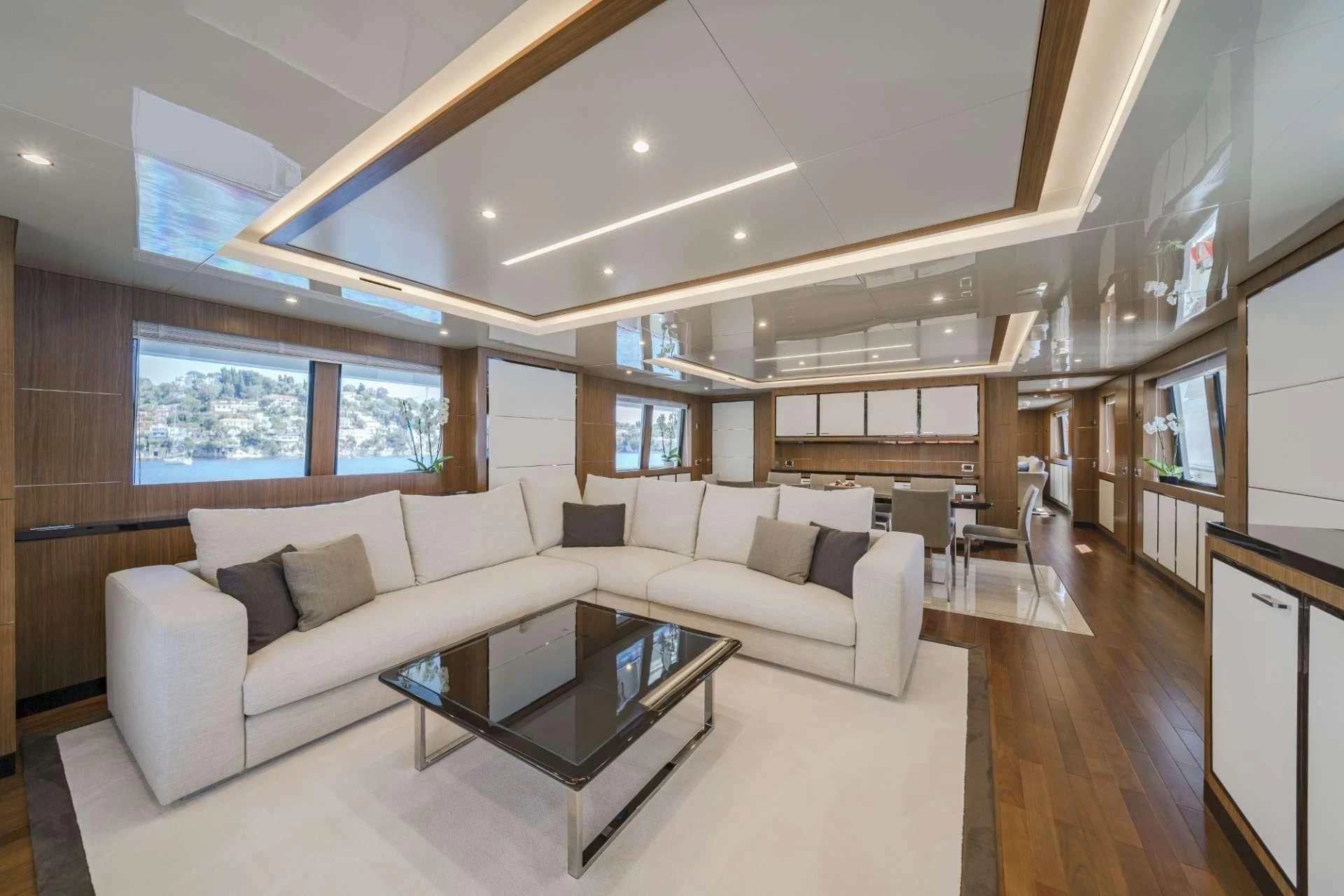 a living room with a couch and a coffee table aboard FIORENTE Yacht for Sale