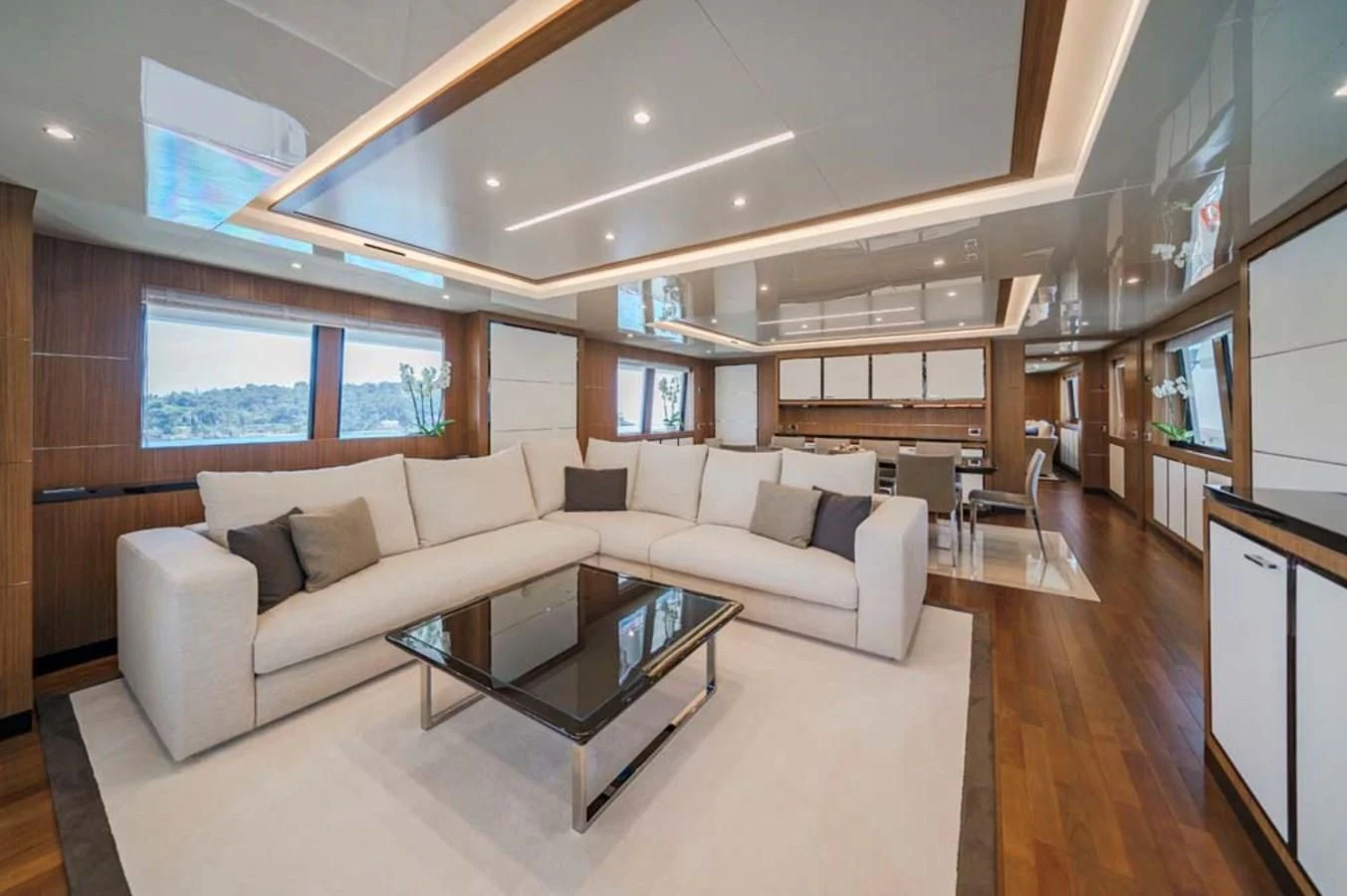 a living room with a couch and a coffee table aboard FIORENTE Yacht for Sale