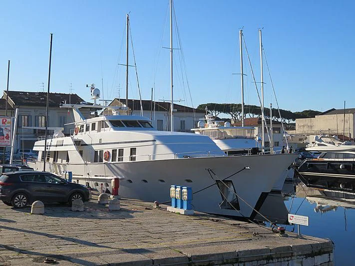 a car parked next to a boat aboard FIORENTE Yacht for Sale